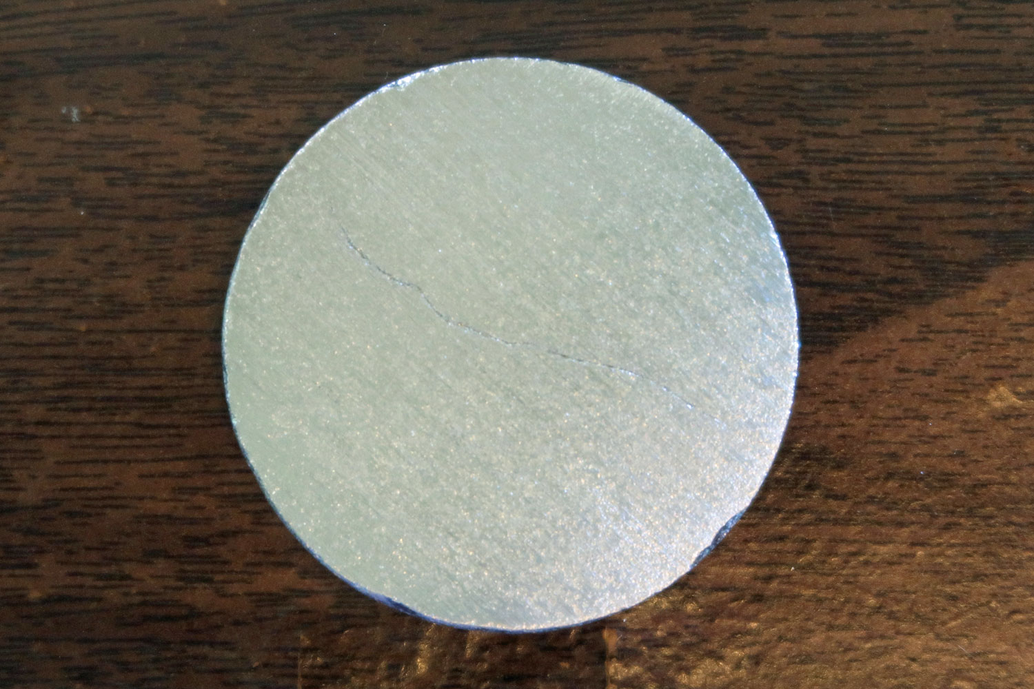 研削中に割れた金属鏡